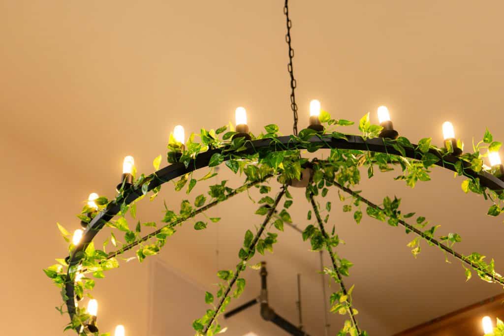 Candlelit greenery chandelier at Connection Room event venue in the Verde Valley